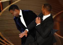 US actor Will Smith (R) slaps US actor Chris Rock onstage during the 94th Oscars at the Dolby Theatre in Hollywood, California on March 27, 2022. (Photo by Robyn Beck / AFP)