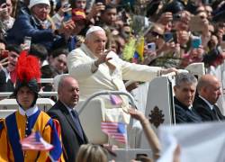 Pope Francis blesses the faithful as he tours St. Peter's square in the popemobile car following the Palm Sunday mass on April 2, 2023 in The Vatican. (Photo by Filippo MONTEFORTE / AFP)