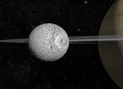 Esta imagen publicada el 7 de febrero de 2024 por Animea Studio - Observatoire de Paris - PSL, IMCCE - muestra una impresión artística de Mimas, de 400 km de diámetro, una de las pequeñas lunas de Saturno.