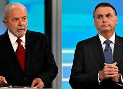 Los candidatos Lula da Silva (I) y Jair Bolsonaro (D) durante un debate televisivo.