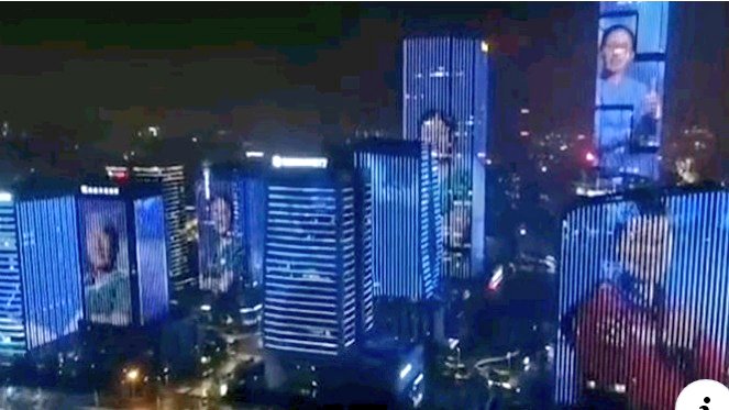 Ciudad China proyecta en sus edificios las caras de los médicos que lucharon contra el #coronavirus