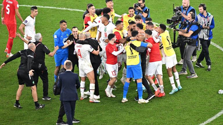 Jugadores de Marruecos celebrando la clasificación a octavos de final de Catar 2022.