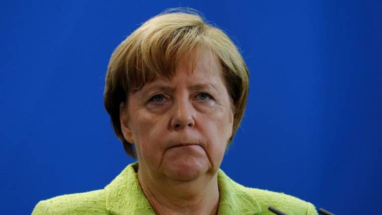 Merkel lamenta decisión de Trump de abandonar Acuerdo de París