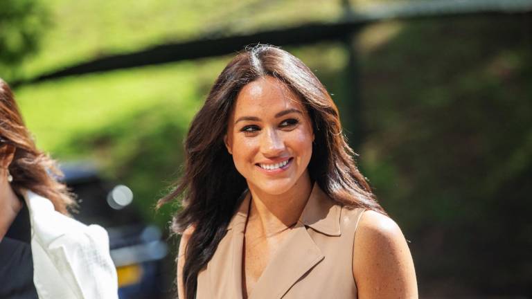 (FILES) In this file photo taken on October 01, 2019 Meghan Markle, the Duchess of Sussex arrives at the University of Johannesburg, South Africa. - Meghan Markle, the Duchess of Sussex, marked her 40th birthday August 4, 2021 with a video asking celebrity friends to help women get back to work after the pandemic. (Photo by Michele Spatari / AFP)