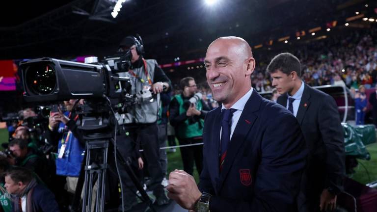 President of the Royal Spanish Football Federation Luis Rubiales (C) reacts at the end of the Australia and New Zealand 2023 Women's World Cup final football match between Spain and England at Stadium Australia in Sydney on August 20, 2023. (Photo by FRANCK FIFE / AFP)