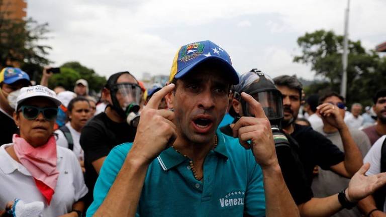 Capriles llama &quot;genocida&quot; a Maduro y lo culpa por la represión