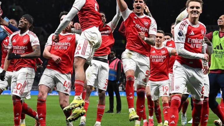 Jugadores del Arsenal FC celebrando una victoria de Premier League.