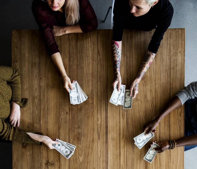 $!Diverse People Hands Hold Money Bill