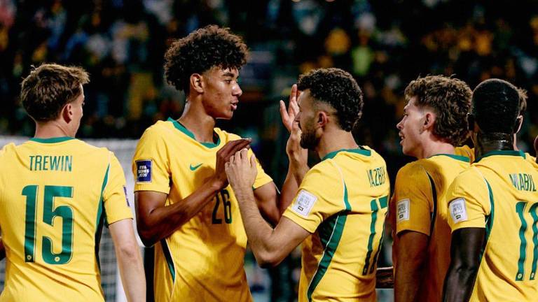 Jugadores de la selección de Australia celebrando una anotación.