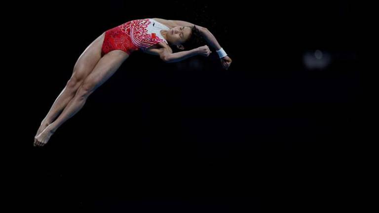 ¡Quan Hongchan logra la perfección y el oro en la plataforma de Tokio!