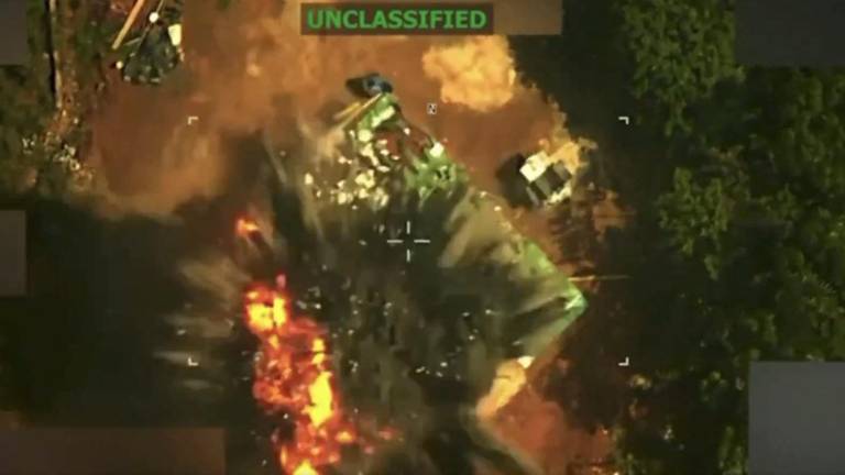Fotografía que muestra la explosión de la edificación donde se hallaba el jefe criminal.